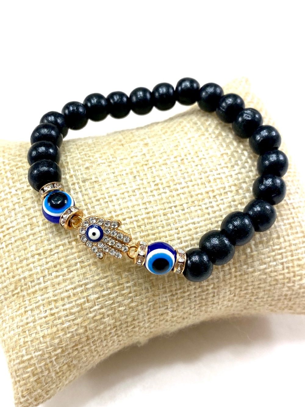 Black Beaded Bracelet with Blue Evil Eye and Gold Hamsa Accent